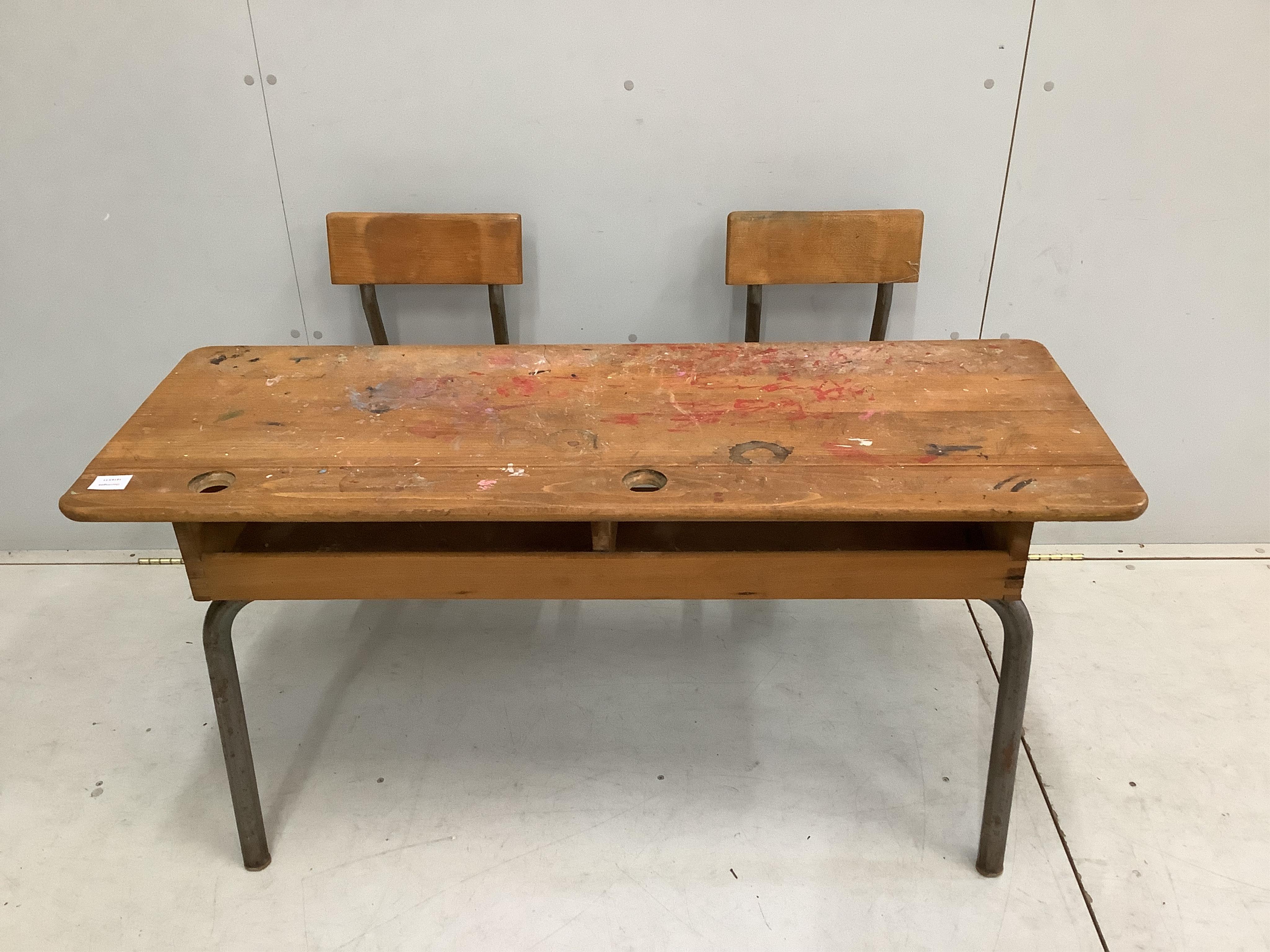 A vintage beech and tubular steel child's double desk, width 119cm, depth 79cm, height 72cm